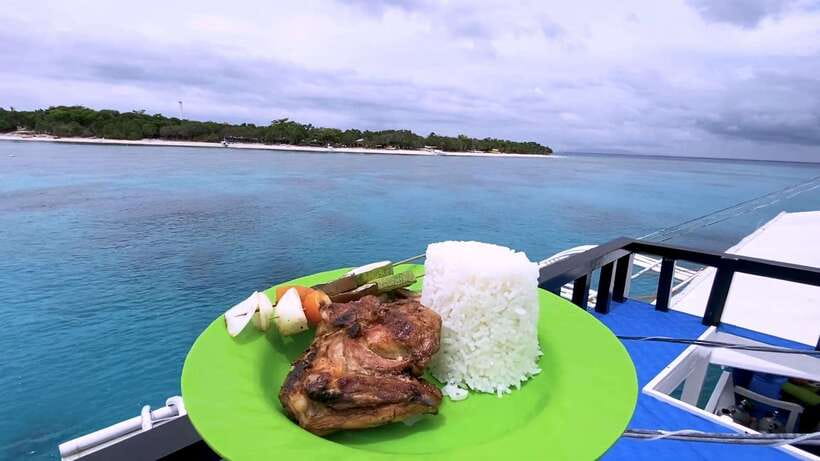 Bohol: Dolphin Watching & Snorkeling at Balicasag Island - Sunrise boats and dolphins near Balicasag