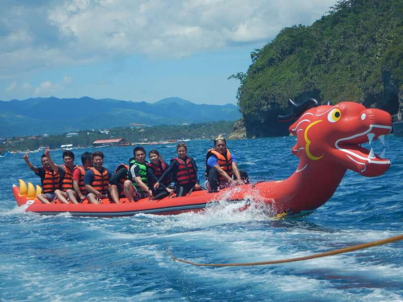 Boracay: Inflatable Banana or Dragon Boat Ride - What happens at the floating water sports station