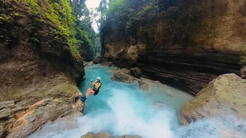Cebu: Kawasan Falls Canyoneering Tour with Ziplining & Lunch - Ambak Base Camp lunch with a sea view