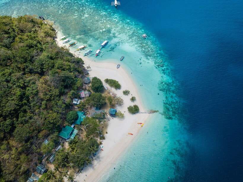 Coron: Coastal Cliffs, Beach & Malcapuya Island Hopping Tour - Three Coron islands, one long day on the water