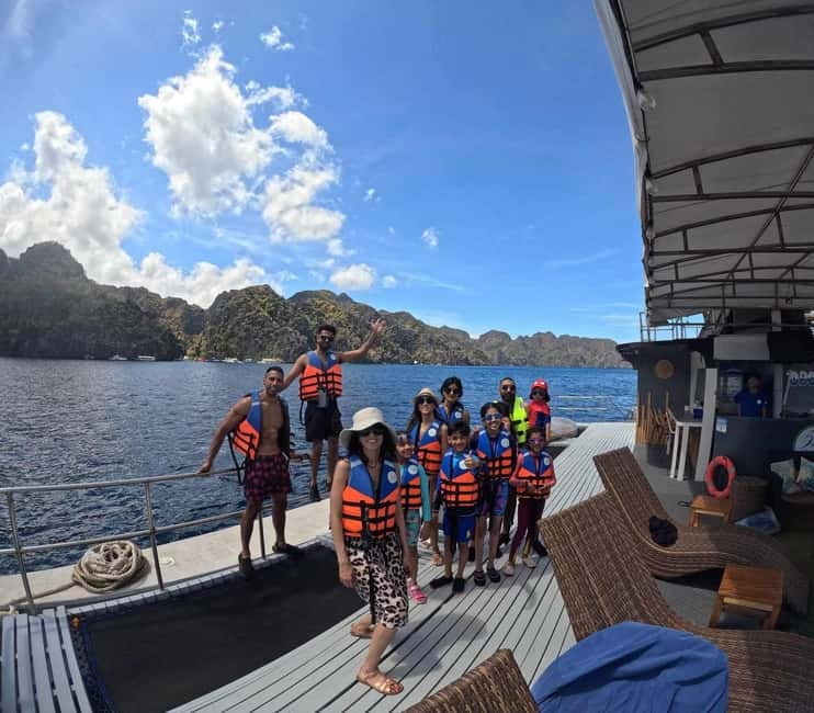 Coron Island: Premier Trimaran Tour - Banul Beach brings lunch, shade, and easy water time