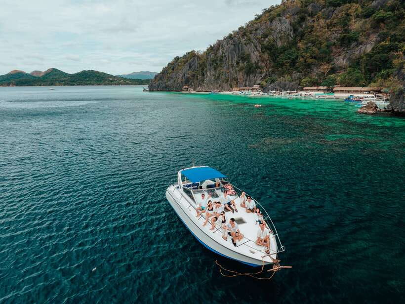 Coron: Private Island-Hopping Tour on a Yacht or Speedboat - Leaving Coron Harbor Square for a private day at sea