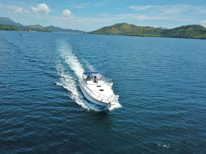 Coron: Private Island-Hopping Tour on a Yacht or Speedboat - Twin Lagoon beneath the limestone cliffs