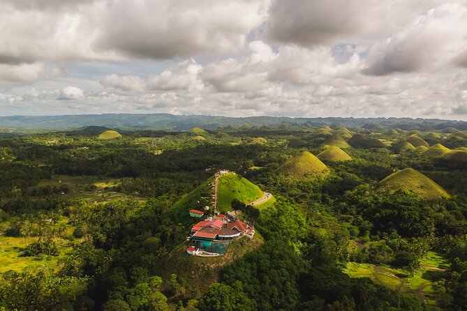 Famous Bohol Chocolate Hills Loboc River Cruise Tarsier Tour - Baclayon Church and Bohol’s colonial past