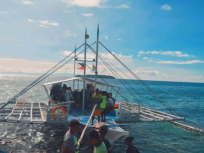 Oslob: Whaleshark Swimming, Tumalog Falls & Sumilon Island - Boat ride and beach time on Sumilon Island